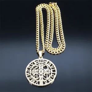 Macro shot of gold Saint Benedict religious medal pendant on cuban curb chain