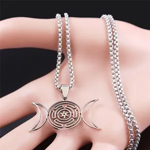 Macro view of stainless steel Hecate's Wheel pendant with triple moon symbol