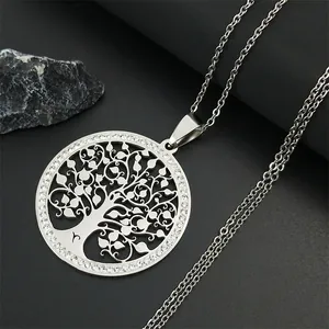 Silver tree of life pendant necklace with sparkling crystal halo on black stone