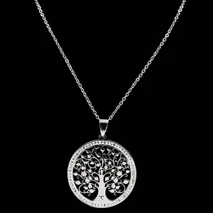 Detail of silver tree of life pendant with intricate cutouts and a classic cable chain