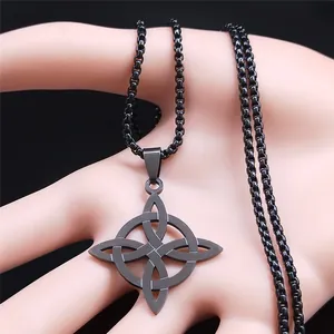 Detail of matte black Celtic knot pendant necklace featuring symmetrical geometry design