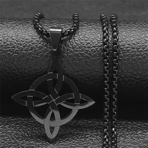 Close-up of black matte stainless steel Witch's Knot pendant on textured leather