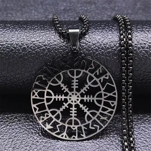 Detail of Viking Vegvisir compass pendant with hollow rune circle on leather background