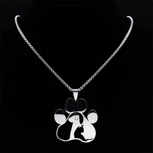 Polished silver paw print necklace with cat and dog silhouette on black display