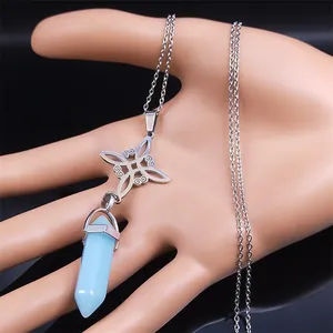 Macro view of light blue hexagonal crystal pendant with silver Celtic knot metalwork