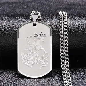 Detail of St. George dragon slayer engraving on silver stainless steel dog tag necklace