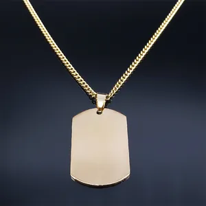 Polished gold Saint Michael Archangel dog tag necklace in stainless steel on black surface