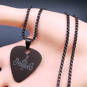 Detail of black stainless steel guitar pick necklace with engraved Music text and treble clef
