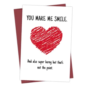 Funny romantic greeting card with red heart and 'You Make Me Smile' text and envelope