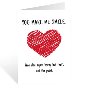 Detailed view of humor greeting card with funny text and red heart graphic