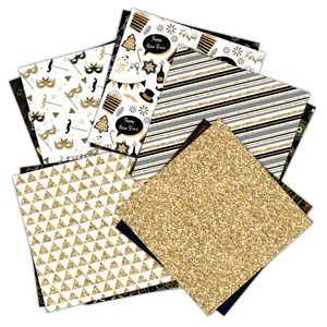 Détail du papier de scrapbooking Nouvel An noir et or avec des motifs festifs pailletés