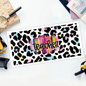Colorful leopard print sticker with black teacher text and pencil motifs for glass cups