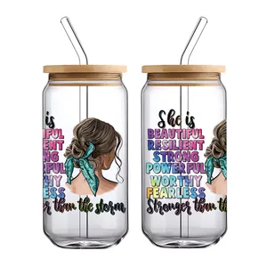 Detail view of two glass cans with bamboo lids and motivational UV DTF transfer stickers