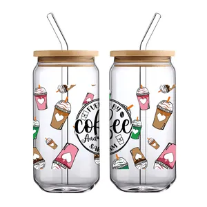 Detail of 16oz glass cups with wood lids and coffee theme UV DTF waterproof stickers