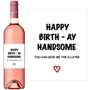 Detail of creative birthday wine bottle stickers featuring humorous text and red hearts