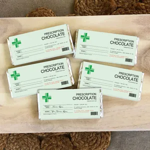 Macro shot of Prescription Chocolate stickers on silver foil bars over a wooden background