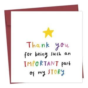 Detail of square greeting card with colorful text and deep red envelope for gifting