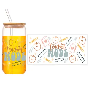 Detailed view of teacher mode UV transfer wrap on a 16oz can-shaped glass cup with bamboo lid