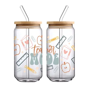 Detail of 16oz can-shaped glass with bamboo lid and straw featuring teacher mode design