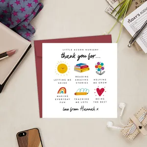 Close-up of a personalized nursery thank you card with a vibrant red envelope and fun graphics