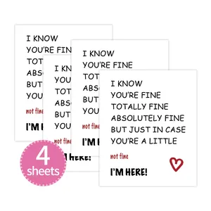 Detailed view of 4 sheets of minimalist white paper stickers with caring typography