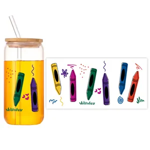 Detail of 16oz can-shaped glass with colorful crayon pattern, bamboo lid and glass straw