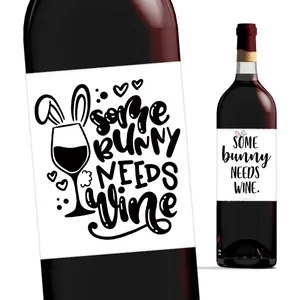Detailed close-up of Easter wine bottle stickers with rabbit ears and creative slogans