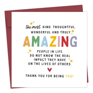 Detailed view of funny square birthday card with red envelope and festive star patterns
