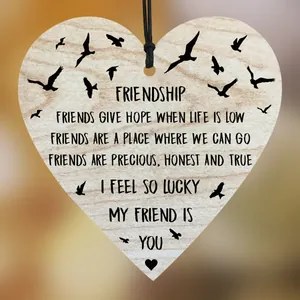 Heart-shaped wooden friendship plaque with birds silhouette and hanging twine decoration