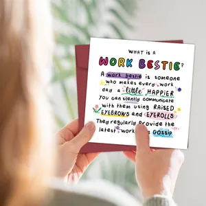 Funny work bestie birthday card with artistic lettering and a red envelope in a lifestyle setting