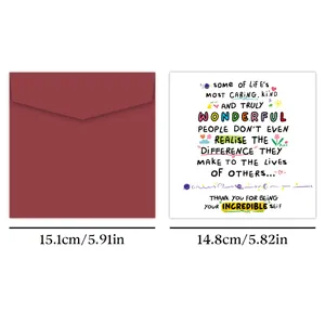 Close-up of square burgundy envelope and card with colorful stars and heart illustrations