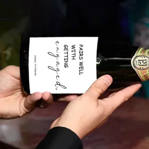 Detailed view of engagement wine bottle sticker with text Pairs Well With Getting Engaged