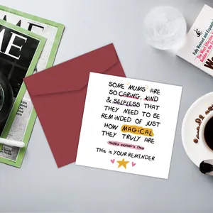 Funny Mother's Day card with burgundy envelope placed on a desk with lifestyle items