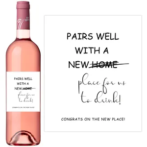 Detail of creative housewarming wine label with funny text on a pink rosé bottle
