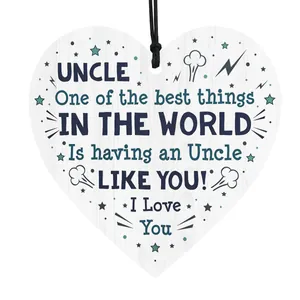 Detail of heart-shaped wooden plaque for uncle with warm quotes and black hanging string