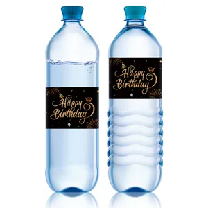 Macro detail of waterproof Happy Birthday water bottle labels with gold glitter crown design
