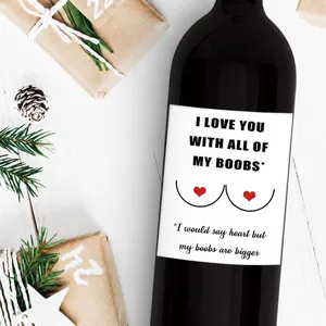 Creative adhesive wine bottle label with funny slogan and red heart on wood background