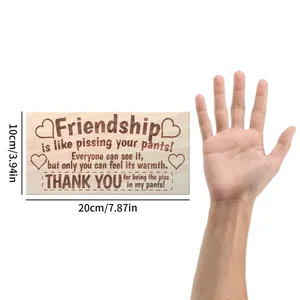 Detail view of wooden wall plaque showing 20x10cm dimensions and funny quote