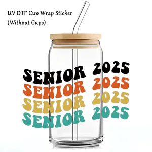Detail of UV DTF cup wrap sticker with retro Senior 2025 design on a 16oz glass cup