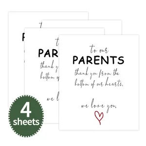 Detail view of 4 sheets of white paper wine bottle labels with black cursive typography