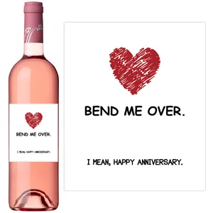 Detail of creative humor anniversary wine bottle stickers with red heart and text design