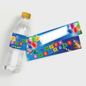 Detail of blue Happy Birthday water bottle labels with balloons and party hat graphics