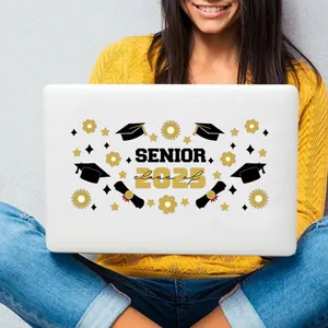 Detail of 2023 Senior graduation UV transfer sticker on a white laptop surface