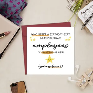 Funny workplace birthday card for boss with red envelope on a stylish office desk