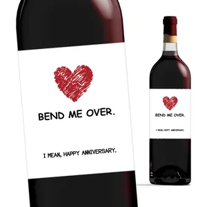 Detail of creative wine bottle labels with red heart graffiti and humorous quotes