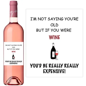 Detail of pink wine bottle sticker with funny text: I'M NOT SAYING YOU'RE OLD
