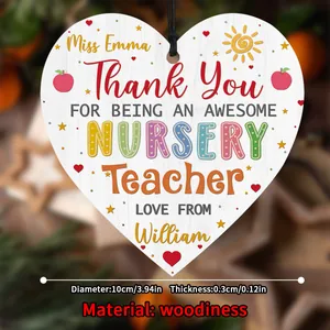 Detail of wooden heart plaque for teachers with colorful illustrations and hanging rope