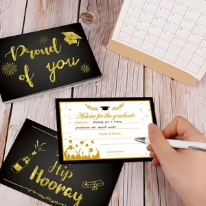 Macro shot of 2025 graduation advice cards with gold foil patterns on a wooden desk