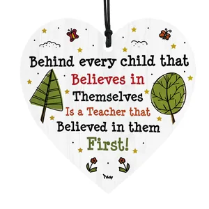 Macro detail of heart-shaped wooden teacher gift plaque with colorful floral print