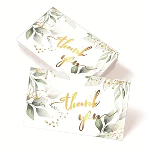 Minimalist Thank You cards with gold foil lettering and green watercolor leaves decoration